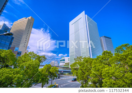 Yokohama cityscape in Japan: View of Yokohama City Hall and the Sakuragicho Station entrance from the pedestrian bridge in front of the new south exit of Sakuragicho Station (August 17th) 117532344