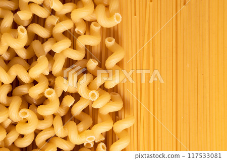 Raw pasta and spaghetti, top view. Italian raw pasta mockup Raw pasta and spaghetti, top view. Italian raw pasta mockup 117533081