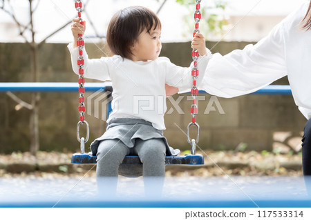 Girl on a swing Girl on a swing 117533314