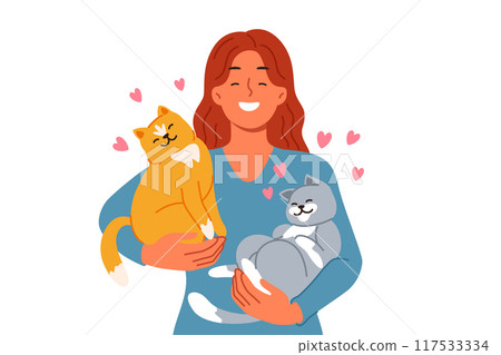 Woman with two cats in arms loves own pets found in shelter with homeless animals Woman with two cats in arms loves own pets found in shelter with homeless animals 117533334