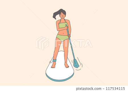 Woman surfer uses SUP board to float down river, and rows paddle to adjust direction 117534115