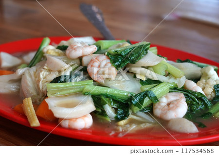 Capcay or A colorful and flavorful stir-fry dish featuring shrimp, vegetables, and egg Capcay or A colorful and flavorful stir-fry dish featuring shrimp, vegetables, and egg 117534568