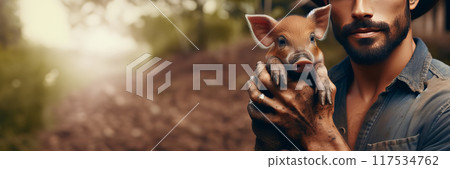 Man holding piglet in hands. Environmental portrait promo photo. Captured at unknown location 117534762
