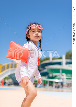 Girl playing in the pool Girl playing in the pool 117535715
