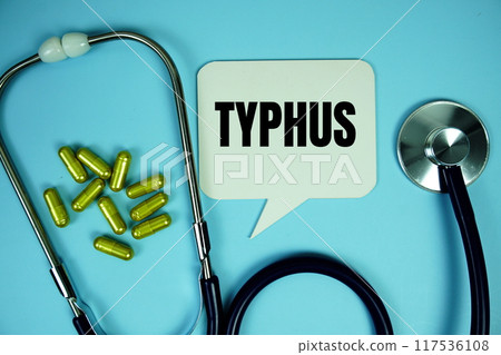 Typhus text with stethoscope and capsule medicine on blue background, Healthy and wellness concept 117536108