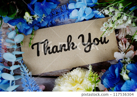 Thank you card with flower bouquet decoration top view on wooden background Thank you card with flower bouquet decoration top view on wooden background 117536304