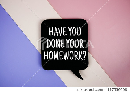 Have You Done Your Homework? text on speech bubble top view on purple geometric background 117536608