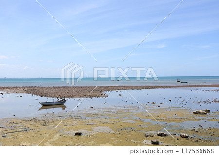 Several small local fishing boats are moored on Samae San's dry coast. Several small local fishing boats are moored on Samae San's dry coast. 117536668