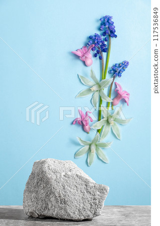 Podium texture stone for presentation and spring flowers pattern on a Podium texture stone for presentation and spring flowers pattern on a 117536849