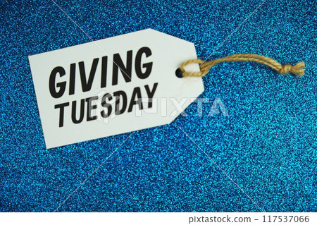 Giving Tuesday text message on paper tag with space for copy background 117537066