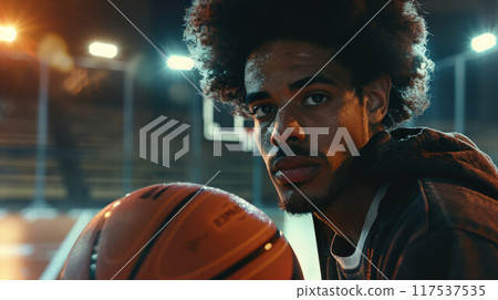 African american man with afro hair basketball player holding ball African american man with afro hair basketball player holding ball 117537535