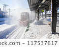 A snowplow clearing snow from inside Iwamizawa Station in winter 117537617