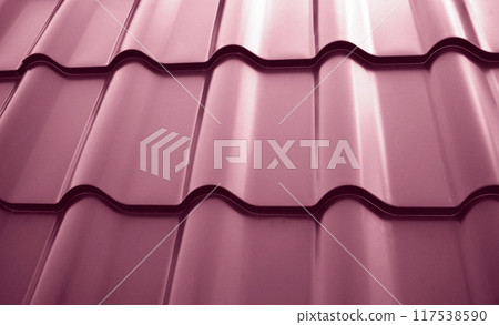 Close-up view lightweight steel roofing sheet. Plum color coated modular tile effect roof panel. Traditional metal shingle tiles. Popular profiled metallic pantile mimic clay or concrete slate 117538590