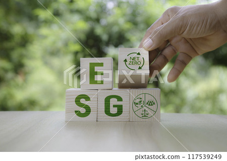 ESG icon in wood on green background. Investing in environmental, social, governance or Invest ESG in industry. ESG investment. Green renewable energy concept. Innovation technology ecology energy ESG icon in wood on green background. Investing in environmental, social, governance or Invest ESG in industry. ESG investment. Green renewable energy concept. Innovation technology ecology energy 117539249