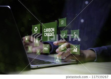 Green energy, Carbon credit market concept. Businessman pointing Carbon credit icon. Net zero in 2050 year. Green energy icon around it. Carbon Neutral in industry Net zero emission eco energy.. Green energy, Carbon credit market concept. Businessman pointing Carbon credit icon. Net zero in 2050 year. Green energy icon around it. Carbon Neutral in industry Net zero emission eco energy.. 117539267