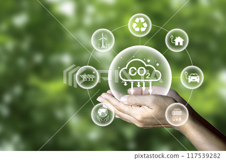 Carbon credit market concept. Green energy carbon neutral Net zero greenhouse gas emissions target at 2050. ethical, eco green energy system icon around CO2 icon on green background.. 117539282