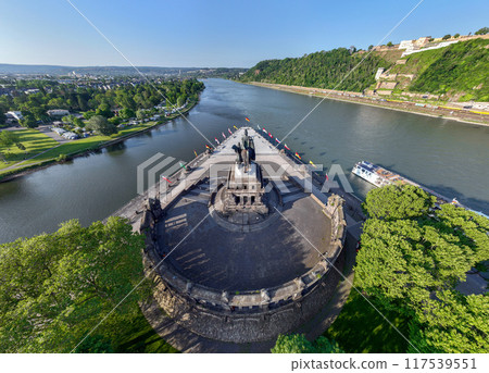 Deutsches Eck or German Corner headland in Koblenz, where the Mosel river joins the Rhine. Aerial 5k shot 117539551