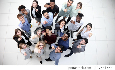 multicultural successful business group looking up in office corridor multicultural successful business group looking up in office corridor 117541368