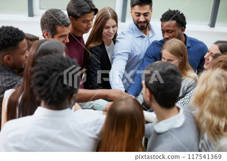 Young College Students Teamwork Stacking Hand Concept 117541369