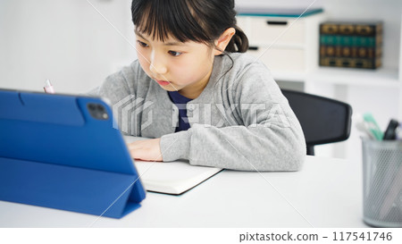 Girl studying on a tablet Online class 117541746