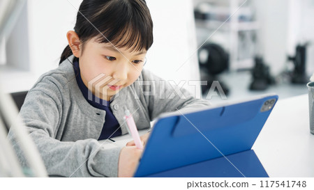 Girl studying on a tablet Online class 117541748