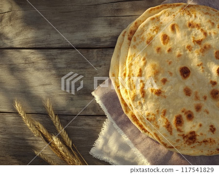 Yom kippur background with matzah and wheat on wooden surface - spiritual reflection 117541829