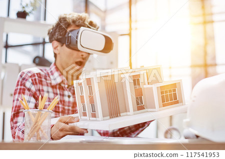 Virtual reality futuristic design technology. Architect or design engineer in VR headset for BIM technology 117541953