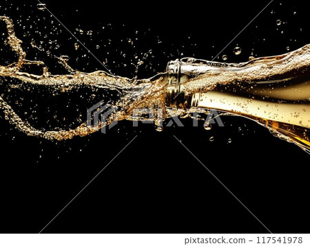 Celebratory champagne splash on black background for elegant party themes 117541978