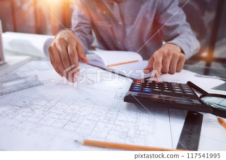 Finally the most brilliant mind in one room. The architect is planning his next project. 117541995