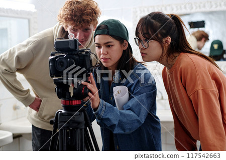 Creative Team Operating Professional Camera in Modern Studio 117542663