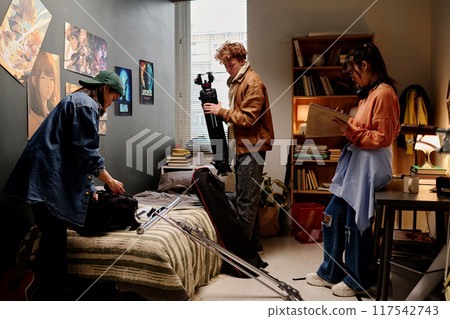 Preparing Filming Equipment in Creative Studio Space 117542743