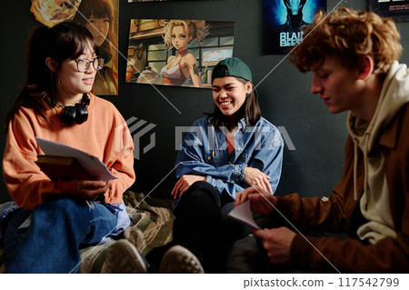 Discussing Artwork in Cozy Studio Setting Discussing Artwork in Cozy Studio Setting 117542799