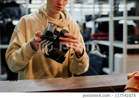 Assembling Camera in Studio Environment with Equipment 117542878