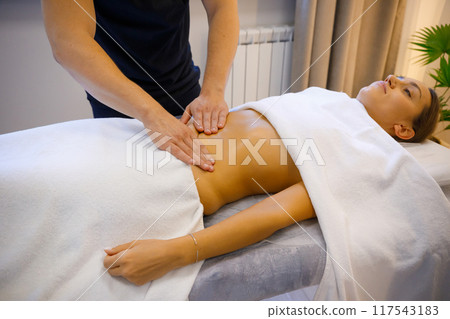 Professional Belly Massage by a Therapist 117543183