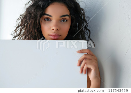 Confident Elegance: Woman with Blank Billboard 117543459