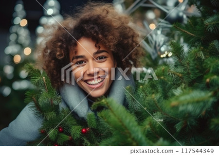 Joyous Woman Creates Yuletide Magic 117544349