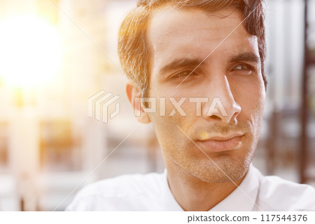 close-up, portrait of a serious businessman on the background of the office 117544376