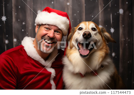 Festive Joy: Man and Pooch Embrace Christmas Cheer Festive Joy: Man and Pooch Embrace Christmas Cheer 117544473