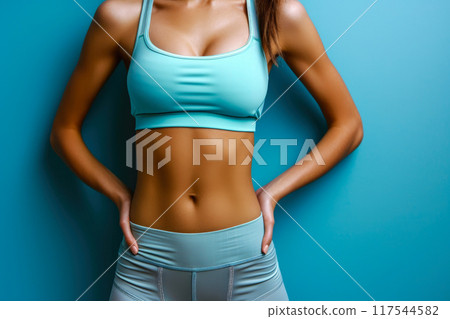 Bold and Beautiful: Female Athlete's Waist in Vibrant Sportswear Bold and Beautiful: Female Athlete's Waist in Vibrant Sportswear 117544582