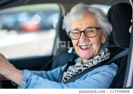 Cheerful Senior Woman Grasping the Road Ahead Cheerful Senior Woman Grasping the Road Ahead 117544666