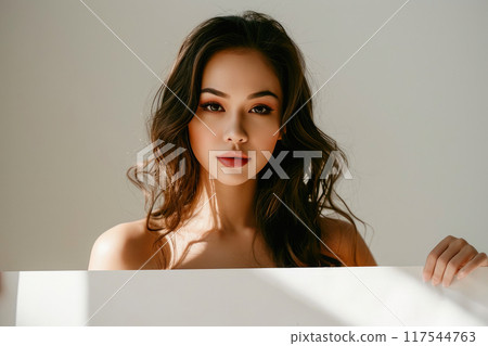 Confident Beauty: Woman with Blank Billboard Confident Beauty: Woman with Blank Billboard 117544763