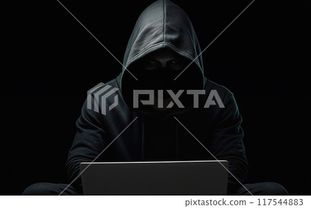 hacker, scammer, in a hoodie with his face covered in shadow, working with a laptop, cybersecurity 117544883