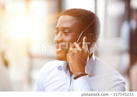 The concept of young people talking on mobile devices. The concept of young people talking on mobile devices. 117545231