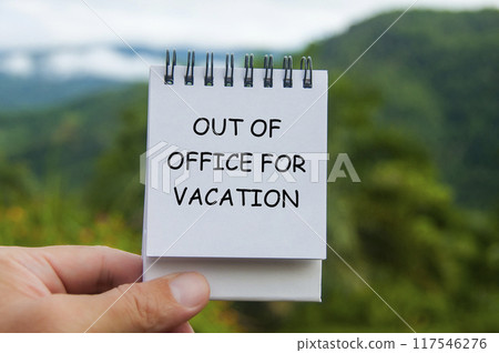 Out Of Office For Vacation text on white notepad with nature background. Out of office concept. 117546276