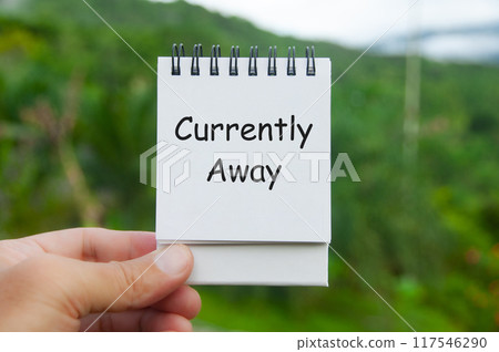 Currently Away text on white notepad with nature background. Out of office concept. Currently Away text on white notepad with nature background. Out of office concept. 117546290