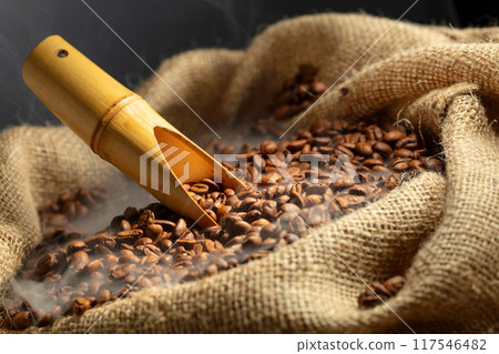 Fresh roasted coffee beans in burlap bag. 117546482