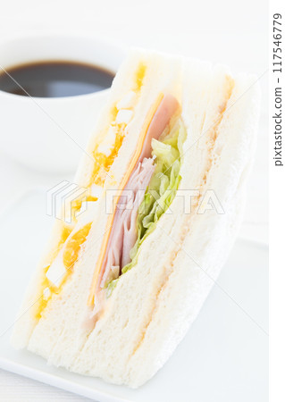 Delicious mixed sandwich and coffee breakfast 117546779