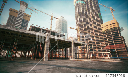 Real estate project construction site with architectural engineer. Residential building construction area Real estate project construction site with architectural engineer. Residential building construction area 117547018