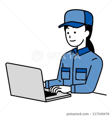 A woman in overalls working on a laptop 117548476