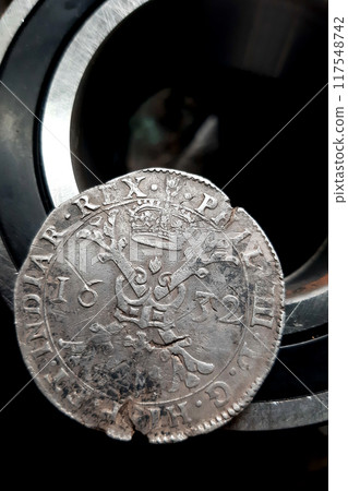 Patagon old coin lying on bearing. Silver thaler brabant Spanish Netherlands 1632 King Philip IV 117548742
